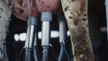 Closeup cow milking automat getting fresh organic product in mechanical cowshed