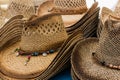 Closeup on cowboy straw brown hats on street market Royalty Free Stock Photo