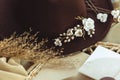 Closeup of a cowgirl hat and flowers, a cowgirl bride