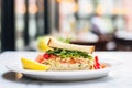 closeup of crab cake sandwich with lettuce in a bistro Royalty Free Stock Photo