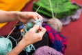 Closeup of crafting hands with wool Royalty Free Stock Photo