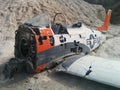 Closeup of crashed Navy plane on small desert hill