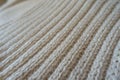 Closeup of cream handmade rib knit fabric