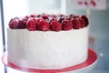 Closeup of cream and raspberry cake