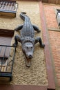 Closeup of a crocodile on a wall in a street in Medina de Rioseco, Valladolid, Spain