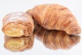 Closeup of a croissant with Pain au chocolat isolated on a white background Royalty Free Stock Photo