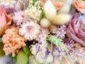 Closeup and crop colorful decorative of dry and paper artificial flowers in bouquet