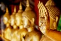 Closeup and crop hand of golden Buddha statue