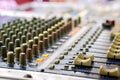Knobs with button of sound music mixer control panel on blurry background Royalty Free Stock Photo
