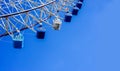 Closeup Giant Ferris Wheel on bright blue sky background