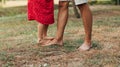 Closeup cropped image of daughter dancing on father`s leg outdoors. Ã¯Â¿Â½ute little girl playing with her loving dad in the park. Royalty Free Stock Photo