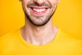 Closeup cropped photo of amazing macho guy looking mirror examining teeth after dental laser cleaning wear casual t