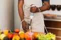 African man preparing healthy food at home in kitchen Royalty Free Stock Photo