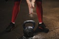 Closeup of crossfit female athlete claping hands and getting ready for kettlebell workout Royalty Free Stock Photo