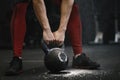 Closeup of crossfit woman lifting heavy kettlebell at gym Royalty Free Stock Photo