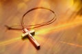 Crucifix on a wooden table with glitters Royalty Free Stock Photo