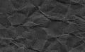 Closeup crumpled dark grey or black paper texture background.Dark ,black paper sheet board with space for text ,pattern or abstrac