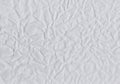 Closeup crumpled light grey paper texture background, texture. Grey paper sheet board with space for text ,pattern or abstract de