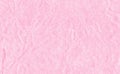 Closeup crumpled light pink paper texture background, texture. Pink paper sheet with space for text ,pattern or abstract backgroun