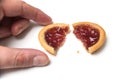 crunched mini tartlets with strawberry jam in hand on white background Royalty Free Stock Photo
