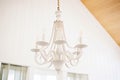 a closeup of a crystal chandelier hanging on a white ceiling Royalty Free Stock Photo