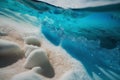 Closeup of crystal clear water surface with white sand and ripples