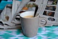 Closeup of a cup of coffee against newspapers