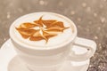 Closeup cup of hot coffee with art foam milk decoration. Royalty Free Stock Photo