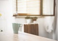 Closeup of a cup of hot coffee with the steam coming out - Cup of tea on a wooden table in a domestic kitchen - warm vintage Royalty Free Stock Photo