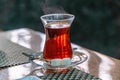 Closeup of cup of Turkish tea with sugar and spoon Royalty Free Stock Photo