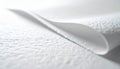 Closeup of curled edge of white textured paper with rough surface Royalty Free Stock Photo