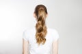 Closeup curly wavy imperfect pony tail back view isolated on white background. Quick easy Not ideal realistic Hair-styles for long