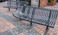 Closeup of curved metallic bench on the street. An abstract view of a contemporary stainless steel bench