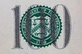 Closeup of cut number 100 of dollar bill on white background Royalty Free Stock Photo