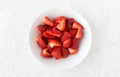 Closeup of cut Strawberries in White Bowl Royalty Free Stock Photo
