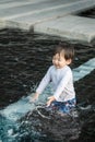 Closeup cute asian kid enjoy in swimming pool textured background in summer of thailand Royalty Free Stock Photo