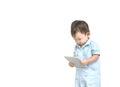 Closeup cute asian kid look at the tablet in his hand with serious face isolated on white background in work concept with copy spa Royalty Free Stock Photo