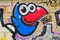 Closeup of a cute blue bird graffiti on a wall