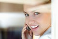 Closeup of a cute female talking over the cellphone. Closeup of a cute young woman speaking over the cellphone. Royalty Free Stock Photo