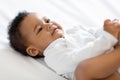 Closeup Of Cute Little Black Baby Boy Of Girl Lying On Bed Royalty Free Stock Photo