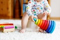 Closeup of cute little 12 months old toddler baby girl child sitting on potty. Royalty Free Stock Photo