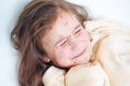 Closeup of cute sad crying little girl in bed. Varicella virus or Chickenpox bubble rash on child Royalty Free Stock Photo