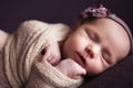 Closeup infant baby girl sleeping at background. Newborn and mothercare concept Royalty Free Stock Photo