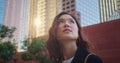 Closeup cute woman look back on city building. Portrait asian girl on sunlight. Royalty Free Stock Photo