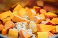 Closeup of cutted pumpkins in a cooking pot with spices, making a delicious soup