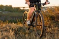 Closeup of cyclist man legs riding mountain bike on outdoor trail Royalty Free Stock Photo