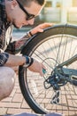 Closeup Cyclist Man Repairing Bicycle