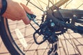 Closeup Cyclist Man& x27;s Hand Repairing Bicycle Wheel