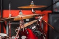Closeup cymbal with drumkit partly visible blurry background, studio equipment concept Royalty Free Stock Photo