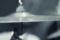Closeup cymbal with drumkit partly visible blurry background, studio equipment concept Royalty Free Stock Photo